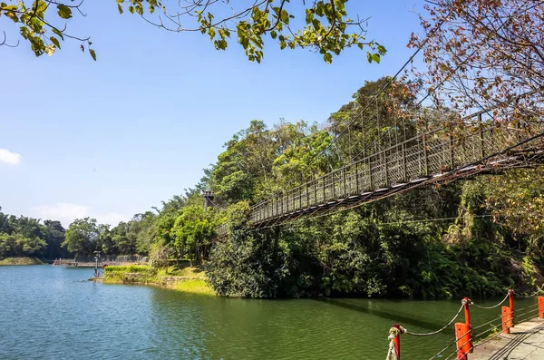 Pond with suspension bridge at Toushe Reservoi — Stock Photo, Image