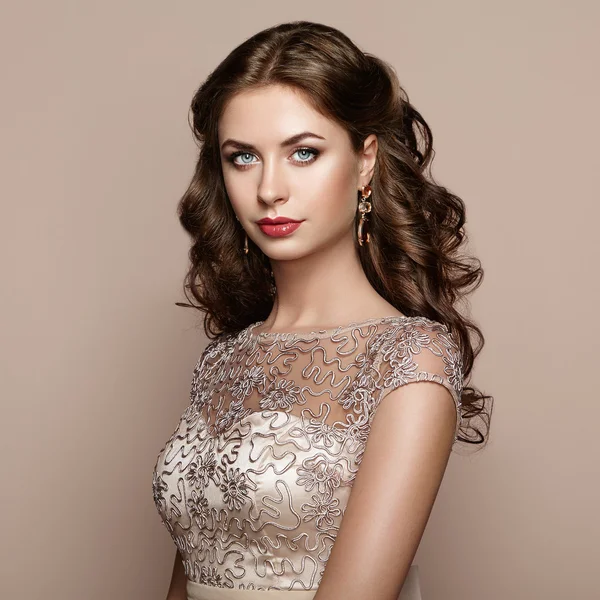 Fashion portrait of beautiful woman in elegant dress — Stock Photo, Image