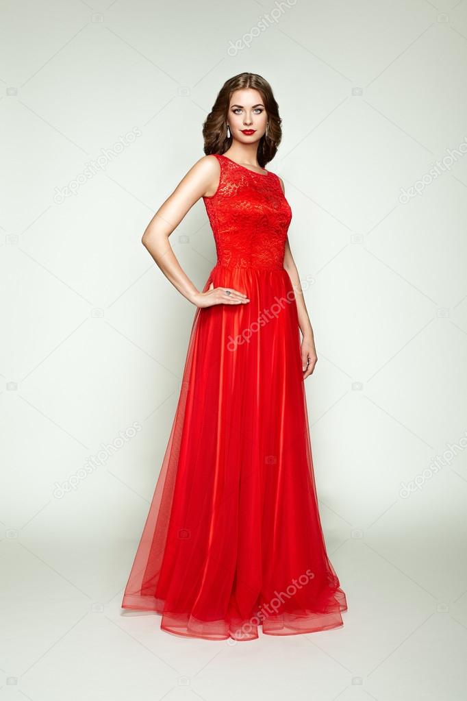 Fashion portrait of beautiful woman in elegant dress