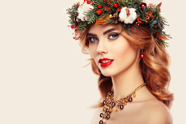 Young woman with Christmas wreath