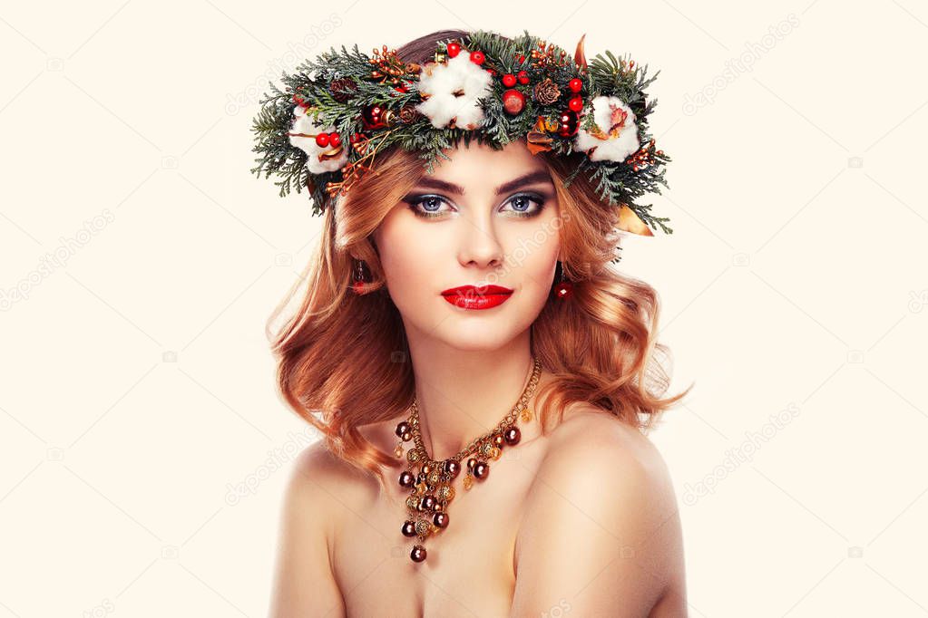 Young woman with Christmas wreath