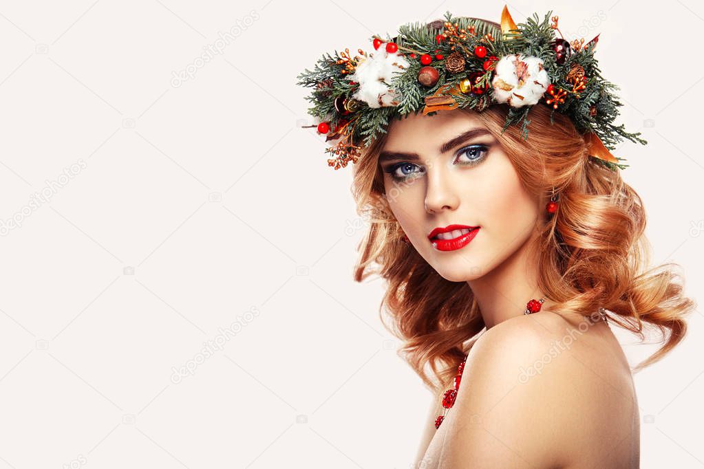 Young woman with Christmas wreath