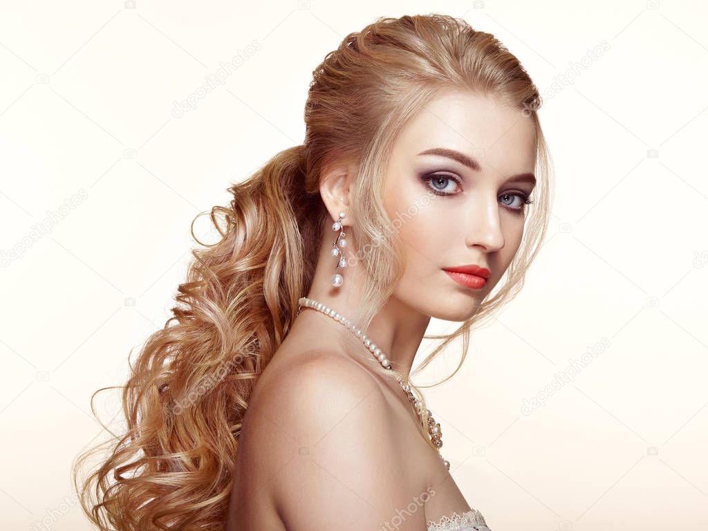 Blonde girl with long and shiny curly hair