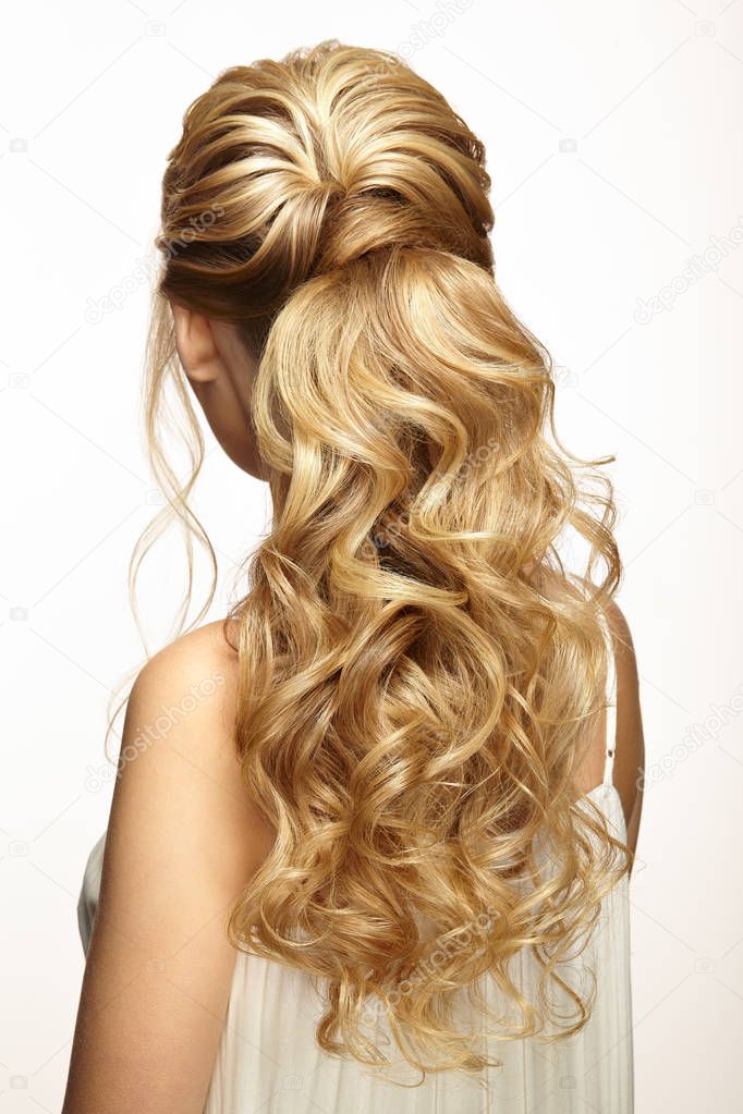 Blonde girl with long and shiny curly hair