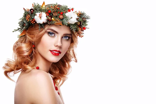 Portrait of beautiful young woman with Christmas wreath — Stock Photo, Image