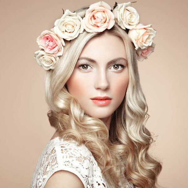 Beautiful blonde woman with flower wreath on her head 
