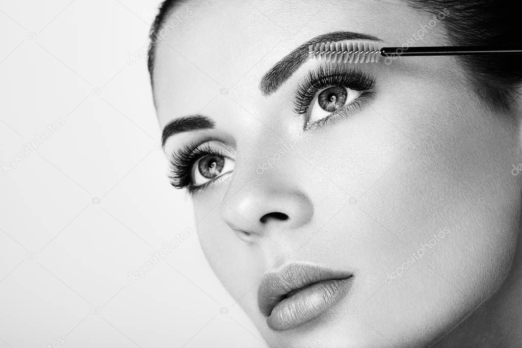 Beautiful woman with long false eyelashes