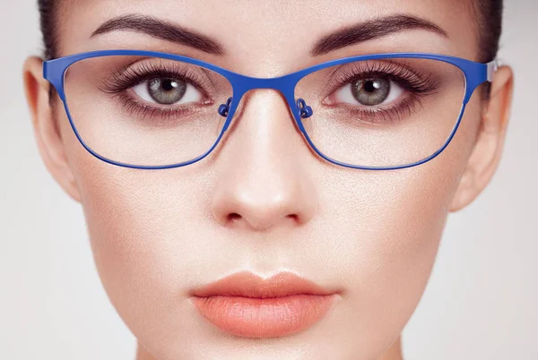 Woman with long eyelashes in eyeglasses — Stock Photo, Image