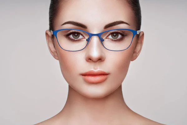 Woman with long eyelashes in eyeglasses — Stock Photo, Image