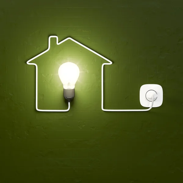 Light bulb in building symbol — Stock Photo, Image