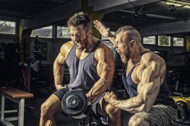 two men working out in gym