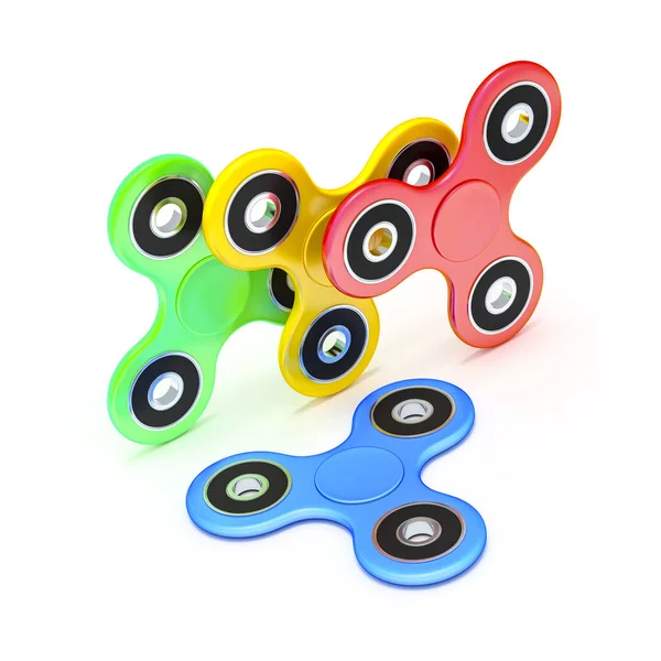 Dört farklı renklerde spinners kıpır — Stok fotoğraf