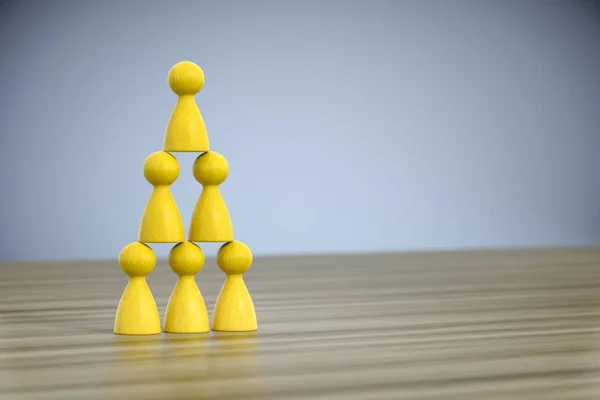 Game figures building a pyramid — Stock Photo, Image