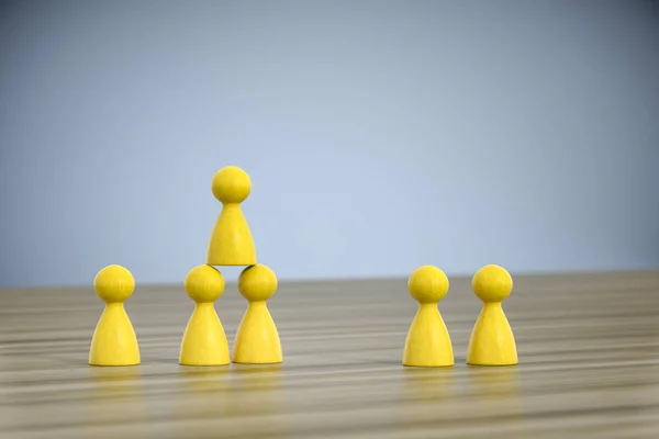 Game figures building a pyramid — Stock Photo, Image