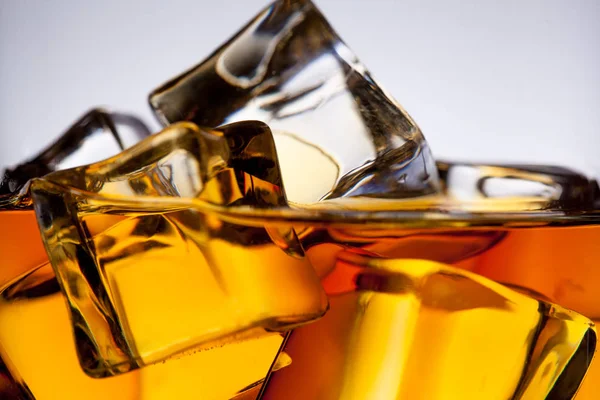 Whiskey glass with ice cubes close-up — Stock Photo, Image