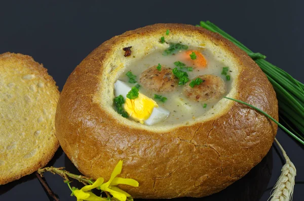 Sour soup in bread — Stock Photo, Image