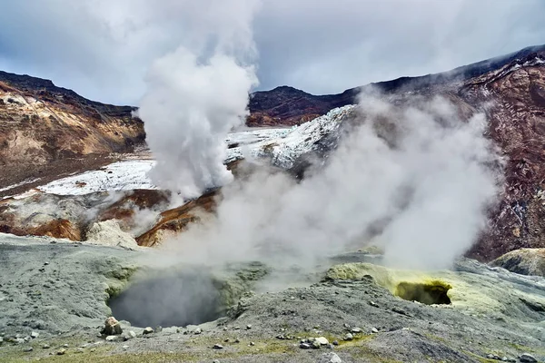 Acid fumaroles in the crater of the Mutnovsky volcano Stock Image