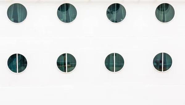 Eight Portholes on White Bulkhead — Stock Photo, Image