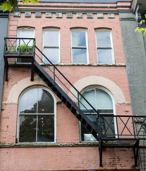 Black Fire Escape on Pale Brick — Stock Photo, Image