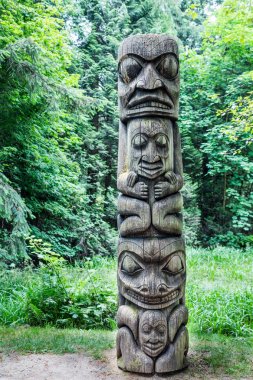 Four Totem Heads on Pole clipart
