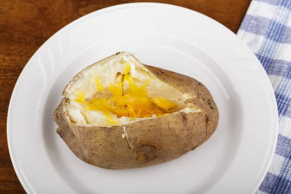 Hot Baked Potato with Cheese on a White Plate — Stock Photo, Image