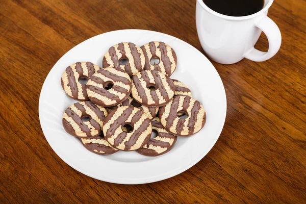 Fudge Striped Cookies on Plate with Coffee — Stock Photo, Image