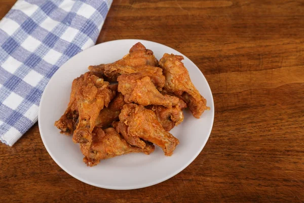 Buffalo Wings on White Plate and Wood Table — Stock Photo, Image
