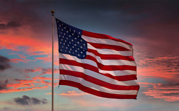Large American Flag at Sunset