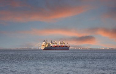 Dredging Ship in Empty Bay at Dusk
