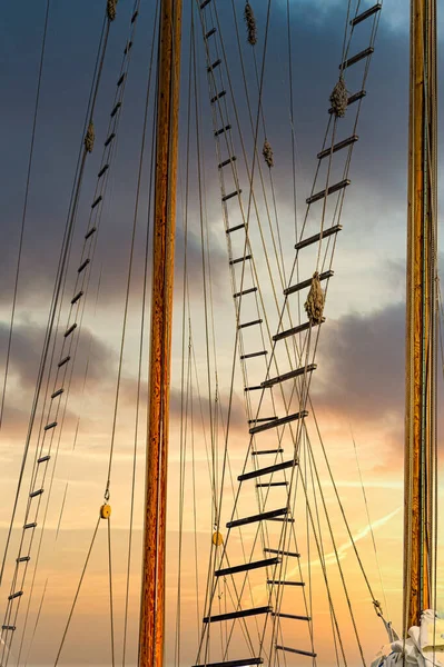 Jacobs Ladders on Masts at Sunset — Stock Photo, Image