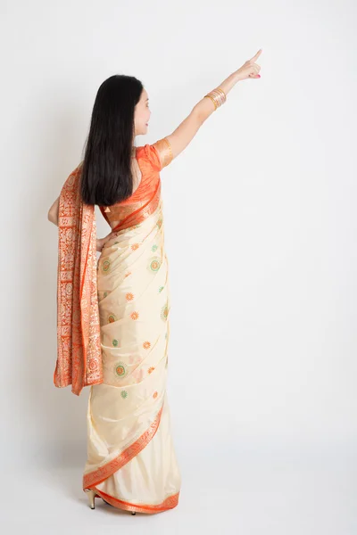 Rear view woman in Indian sari dress pointing — Stock Photo, Image