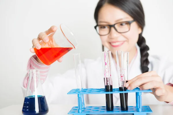 Young Asian female scientist in lab — Stock Photo, Image