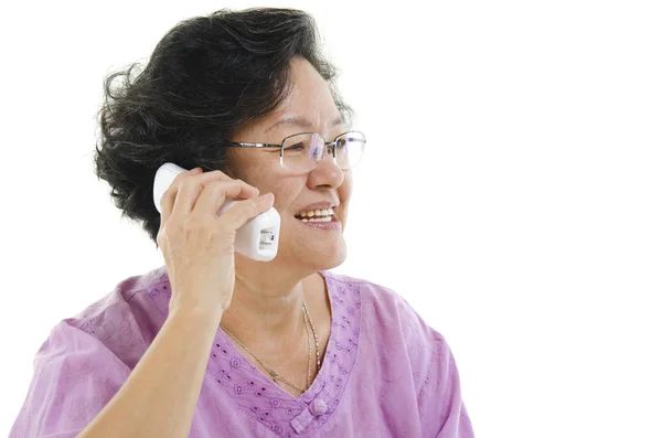 Senior adult woman calling on phone — Stock Photo, Image