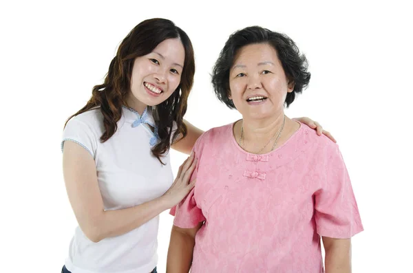 Asian senior mother and adult daughter smiling — Stock Photo, Image