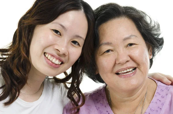 Senior mother and adult daughter close up face Stock Picture
