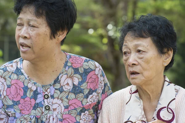 Asian elderly women gossiping outdoor — Stock Photo, Image