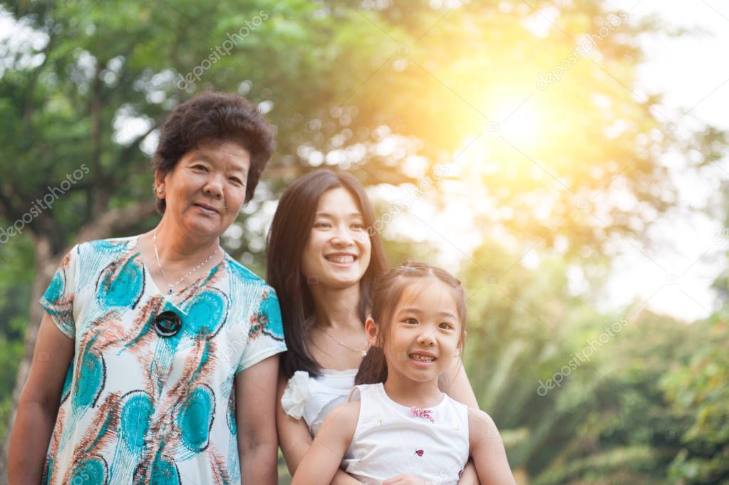Grandmother, mother and daughter portrait.