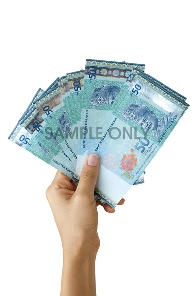 Hand holding ringgit Malaysia valuta — Stockfoto