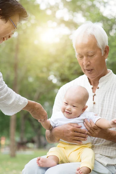 Grandparents and grandson having fun outdoors. — Stock Photo, Image