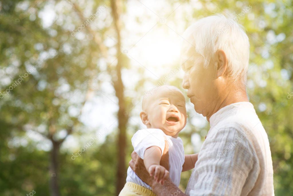 Grandfather and crying grandson.