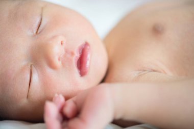 Asian newborn baby is sleeping clipart
