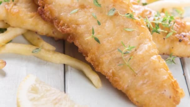 Fish fillet with french fries — Stock Video