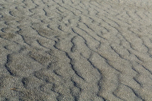 Černý písek, pozadí — Stock fotografie