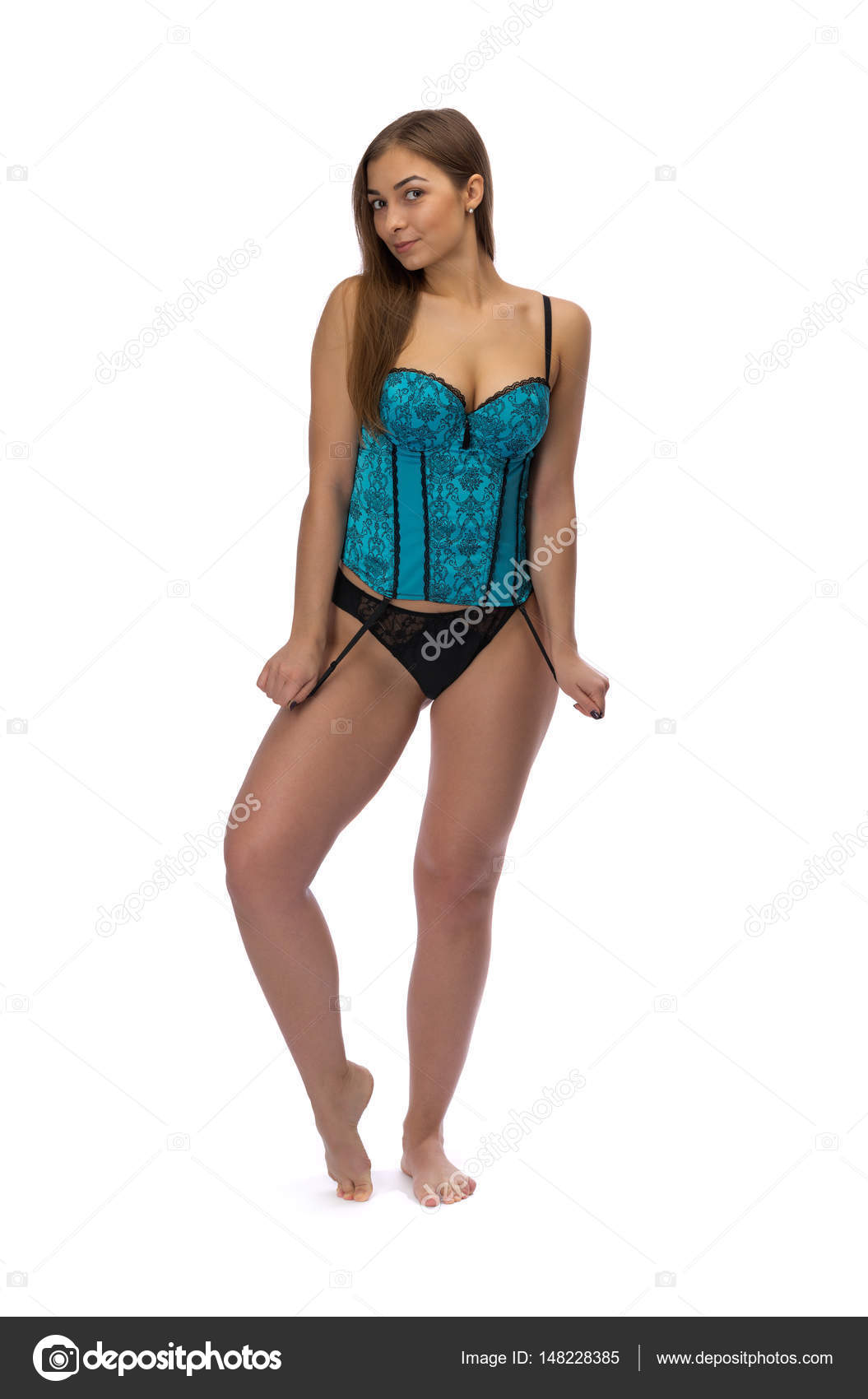 Foto de Sensual brunette woman posing in lingerie. Sporty sexy young girl  posing in studio. White Corset bra do Stock
