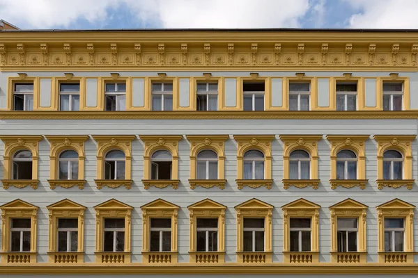 Facade of a building, windows, yellow walls — Stock Photo, Image