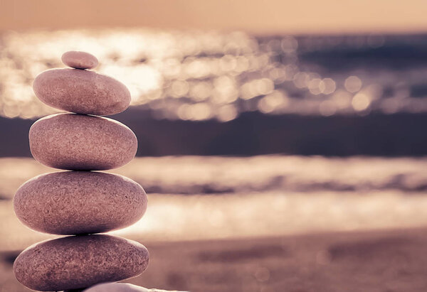 Vintage hipster style Zen meditation background, balanced stones
