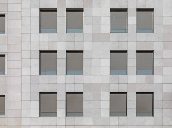 Gray Windows at Modern Marble Building Facade
