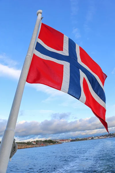 Norwegian Flag at Boat Flagpole Blue Sky and Sea