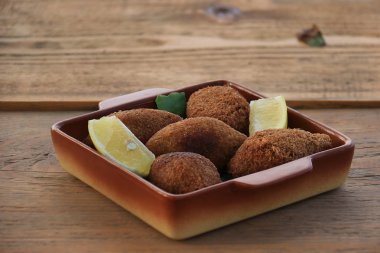 Vegan Kibbeh on Rustic Wooden Table clipart