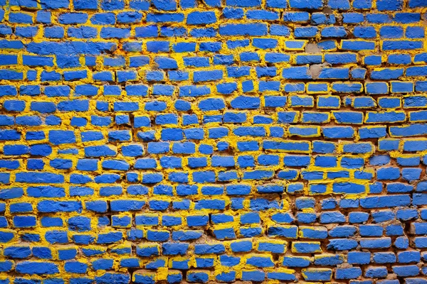 Ziegelwand Blau Und Gelb Gestrichen — Stockfoto